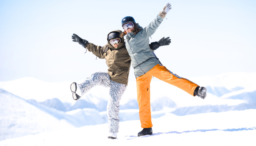 Father and son snowboarding