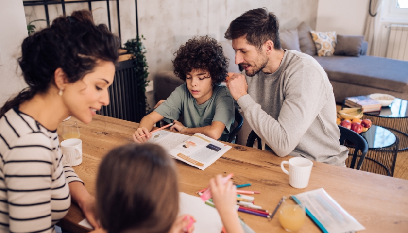 Family of four around table