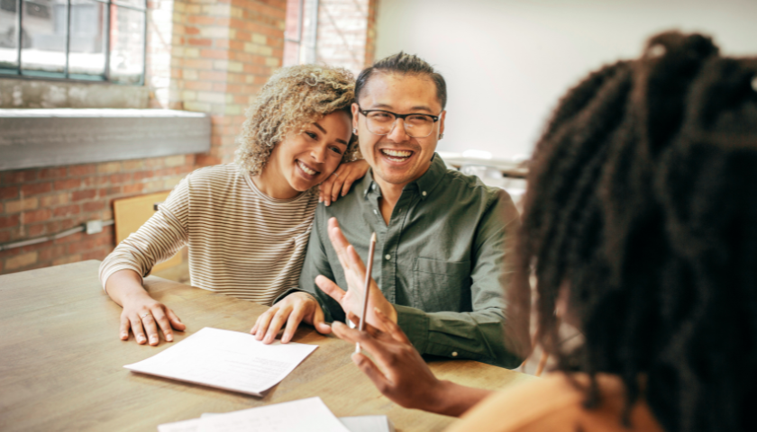 happy couple getting a mortgage