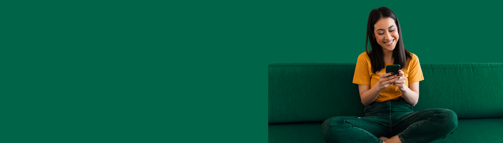 young woman sitting on couch smiling