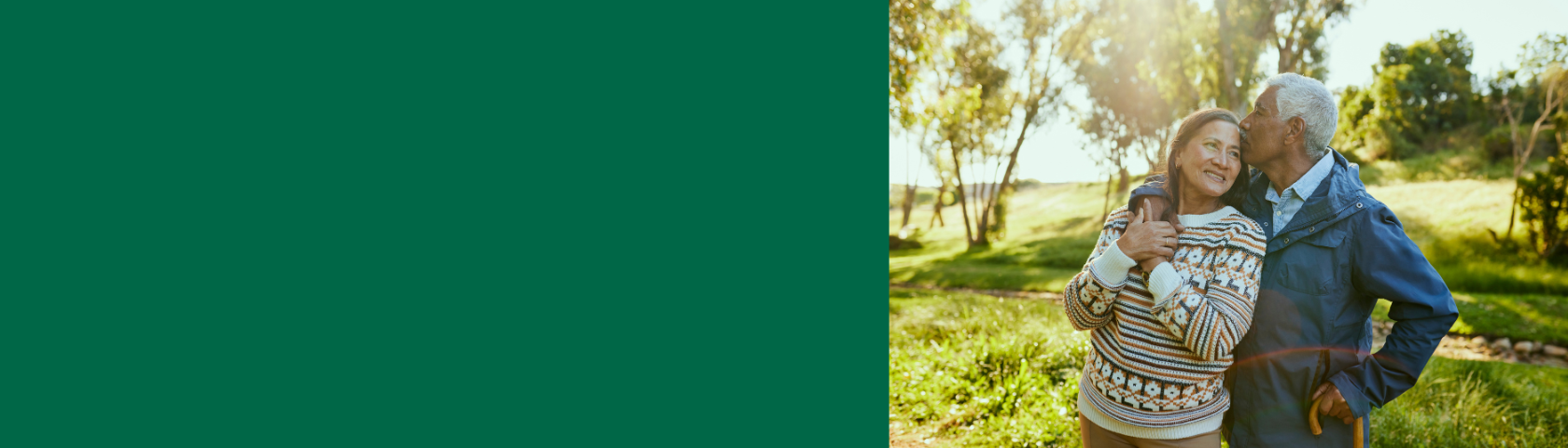 senior couple hugging in park